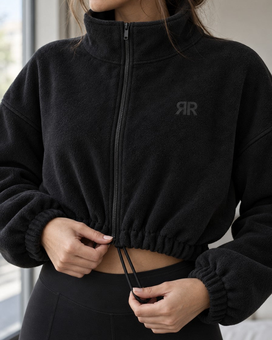 Detalle de la tela tipo peluche y el cordón de la Chaqueta Era negra
